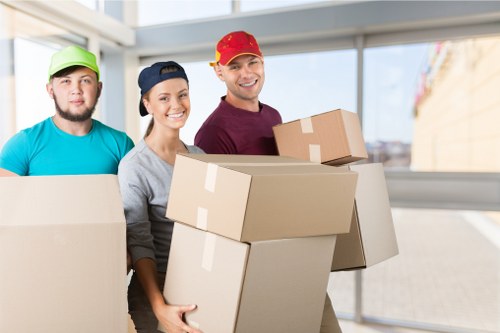Packed boxes and labeled items ready for house removals in Pinner