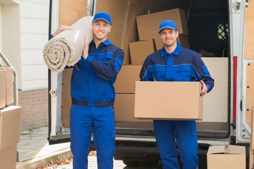 Trained movers handling furniture with care