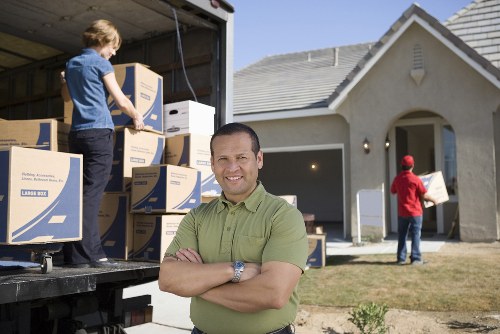 Planning flat removals in Pinner with checklist, labels, and packed moving boxes