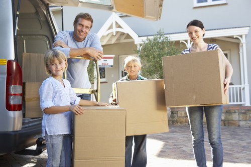 Furniture and packed belongings prepared for transport during a house move