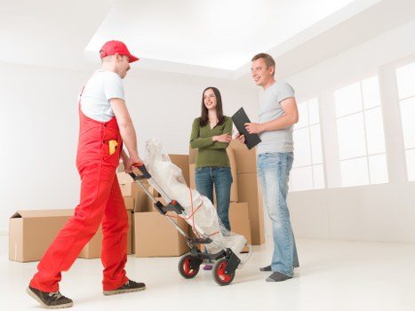 Furniture and boxes being loaded into a removals van in Pinner