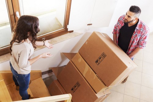 Careful loading of household furniture into a van in Pinner