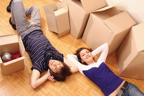 Professional movers handling office furniture during a Pinner relocation