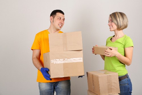 Packed boxes and moving equipment ready for a same day move in Pinner